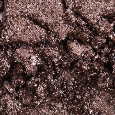 Swatch of an iridescent smokey grey eyeshadow with very fine shimmer. 