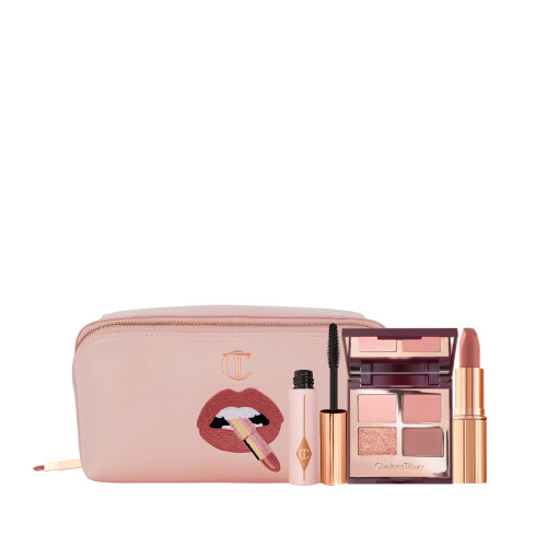 a pink makeup bag, mini black mascara, pink eyeshadow quad and rose pink lipstick