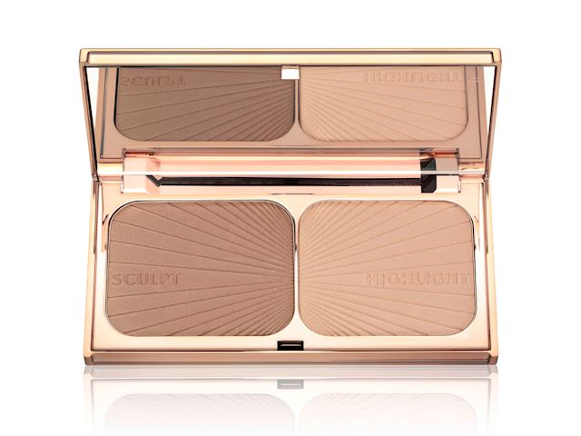 An open, mirrored-lid bronzer and highlighter duo in golden-coloured, metallic packaging. 