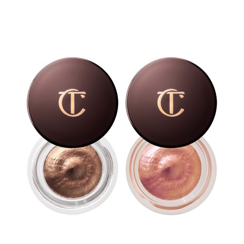 Two cream eyeshadows in soft gold and coppery-rose gold shade in glass pots with dark brown lids with the CT logo printed on the top.