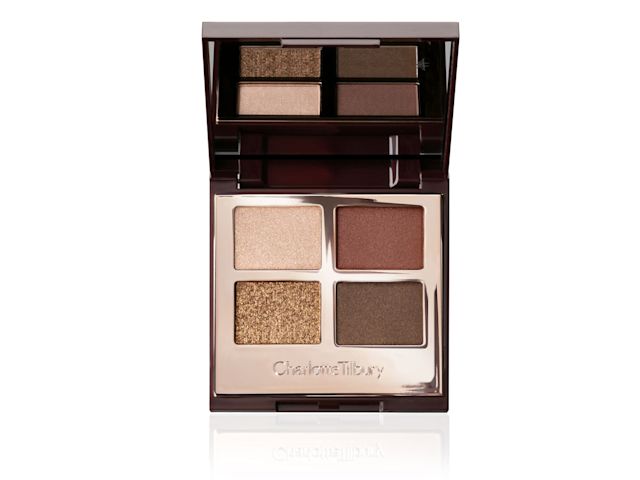 An open, mirrored-lid quad palette in shimmery and matte golden and earthy tones. 
