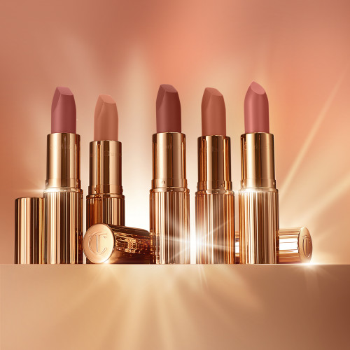 Five, matte and satin finish, open lipsticks in gold-coloured tubes in nude shades of rose-brown, peach, rose-pink, apricot, and medium pink.