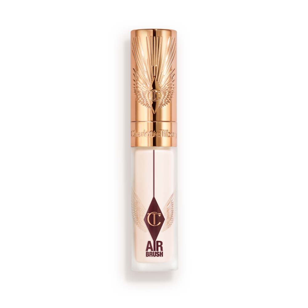 Charlotte Tilbury Airbrush Flawless Concealer in a frosted tube with rose-gold cap and winged design, displayed upright with lid closed.