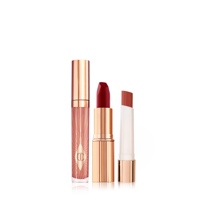 Nude pink lip gloss in a glass tube with a gold-coloured lid, blood-red matte lipstick in a gold-coloured tube, and lipstick lip balm in a soft tawny-red colour.