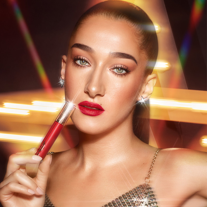 Bella Tilbury wearing Ruby Blur ruby red lipstick