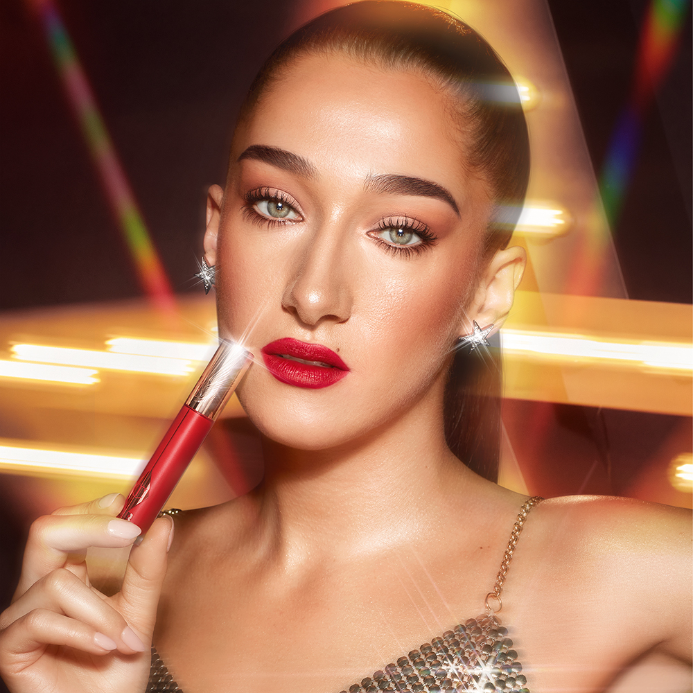 Bella Tilbury wearing Ruby Blur ruby red lipstick