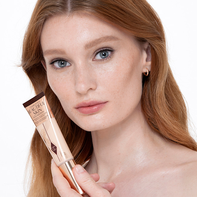 Beautiful Skin Foundation in 1 Neutral on fair-tone model Fair-tone model with glowy, flawless skin, wearing skin-like foundation that adds a youthful glow and looks natural along with nude pink lipstick and subtle everyday eye makeup.