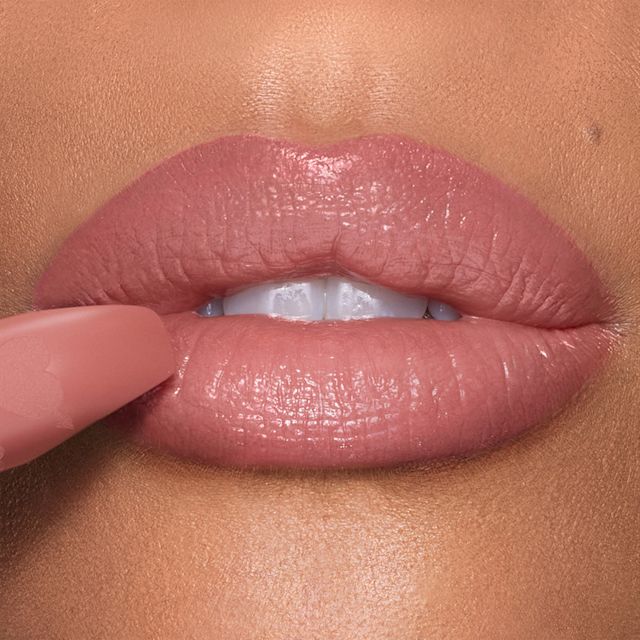 Naughty Talk nude lipstick close up on medium skin