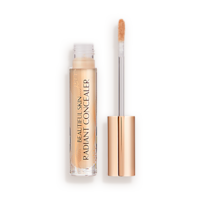 Radiant concealer in a glass tube with its doe-foot applicator next to it with a gold-coloured handle.