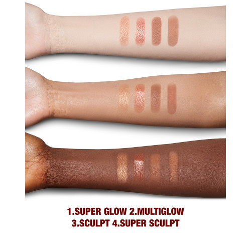 Fair, tan, and deep-tone arms with swatches of a face palette that include a reflective fawn eyeshadow that can be used as a highlighter, dark brown-peach blush, and a contour and eyeshadow duo in brown shades.