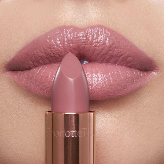 Model wearing Pillow Talk Fair cool-pink satin lipstick