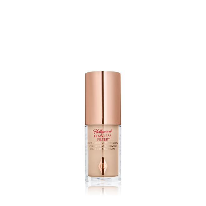 A closed glow-boosting primer in a glass bottle with a rose gold-coloured lid. 