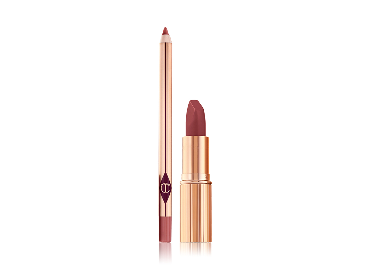 Lip liner pencil in a medium-pink shade and an open matte lipstick in a medium-pink shade in a gold-coloured tube.