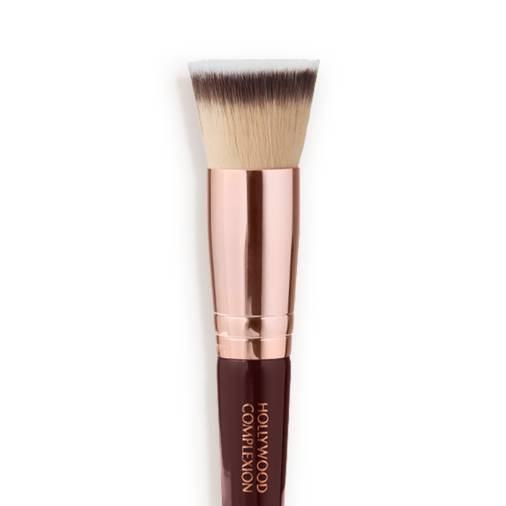 Close-up of a face blending contour brush with fawn, dark brown, and white-coloured bristles with rose-gold and dark crimson handle. 