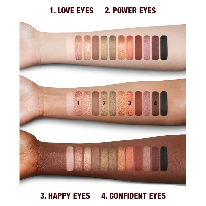 Fair. tan, and deep-tone arms with swatches of twelve matte and shimmery eyeshadows in shades of gold, brown, green, peach, pink, red, and black.