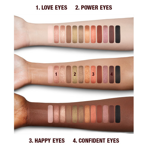 Fair. tan, and deep-tone arms with swatches of twelve matte and shimmery eyeshadows in shades of gold, brown, green, peach, pink, red, and black.