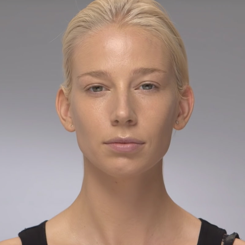 A light-tone blonde model wearing a medium-coverage, satiny foundation. 