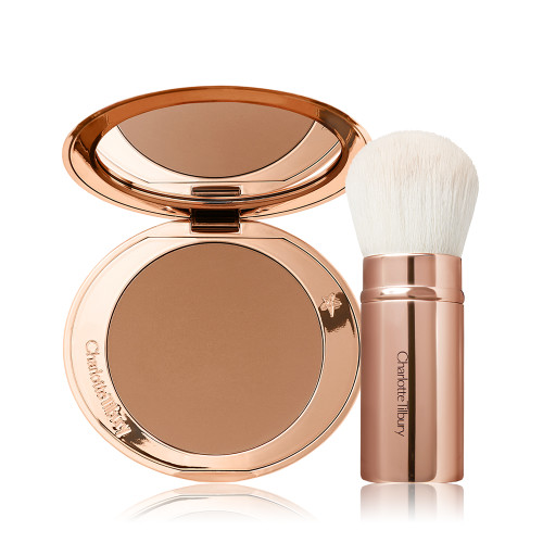 An open bronzer compact in a light brown shade and a kabuki brush with white-coloured bristles and a gold-coloured handle. 