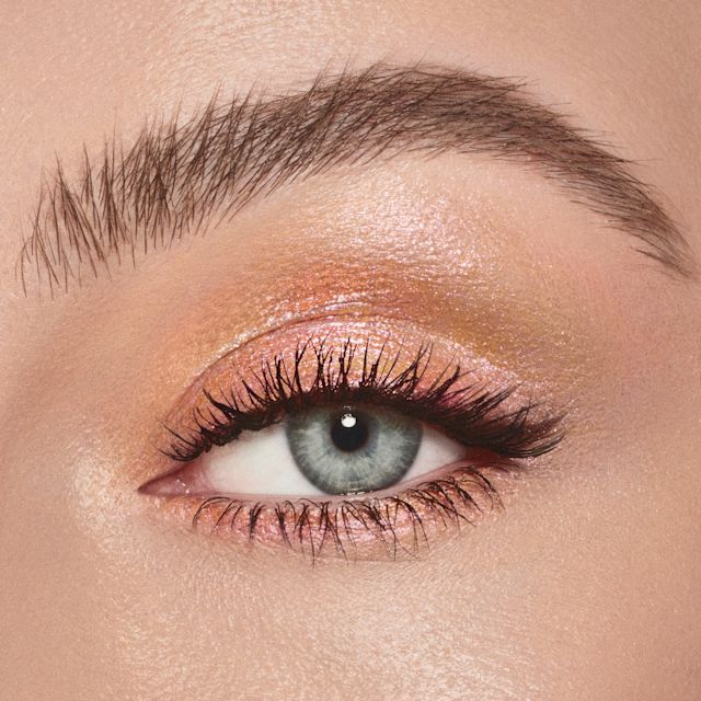 Model wearing a duochrome eyeshadow look using Eyes to Mesmerise in Sunlit Glow