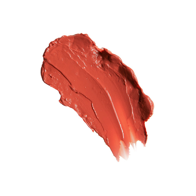 Swatch of glossy soft coral lipstick lip balm.