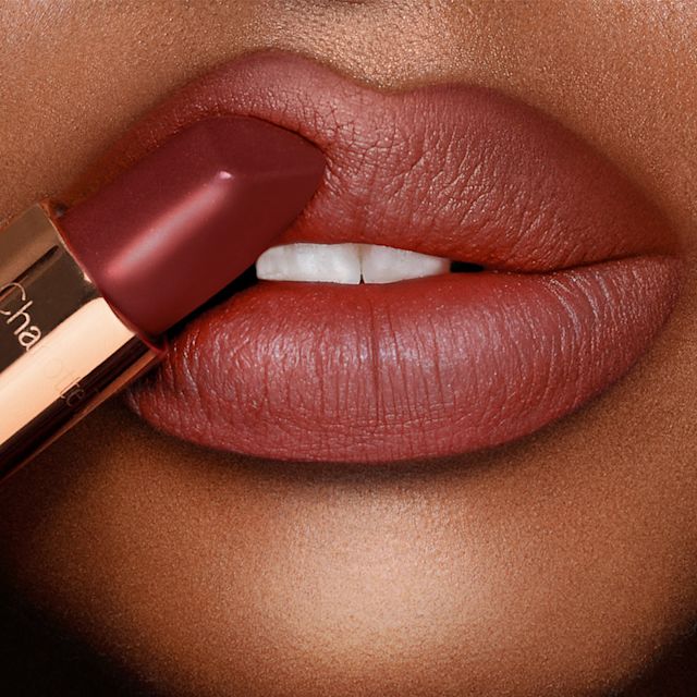 Model wearing Foxy Brown and 90s Brown lip liner and lipstick combination
