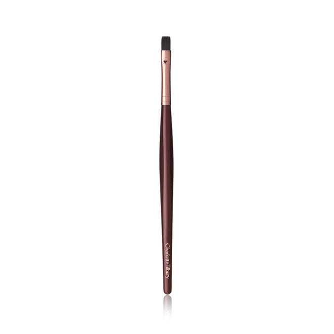 A slim lip brush in dark crimson and gold colour scheme.