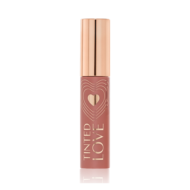 Tinted Love in Santa Euphoria closed A closed lip and cheek tint with a gold-coloured lid in a soft nude brown-coloured tube.