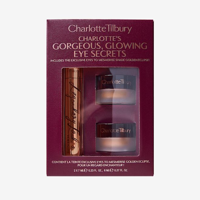 Gorgeous Glowing Eye Secrets packed Maroon-coloured gift box with two eyeshadow pots with cream eyeshadows in different shades of gold along with black mascara in a gold-coloured tube.