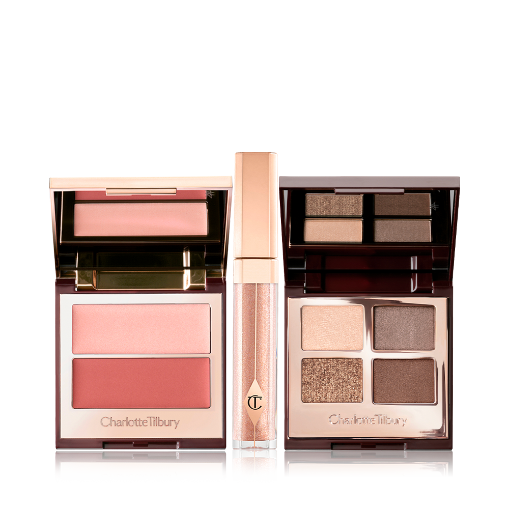 Opn dual blush palette with light pink and dark pinkish peach blushes, a shimmery dark champagne lig gloss with a gold-coloured lid, and an open mirrored-lid quad eyeshadow palette with brown, grey, and beige eyeshadows. 