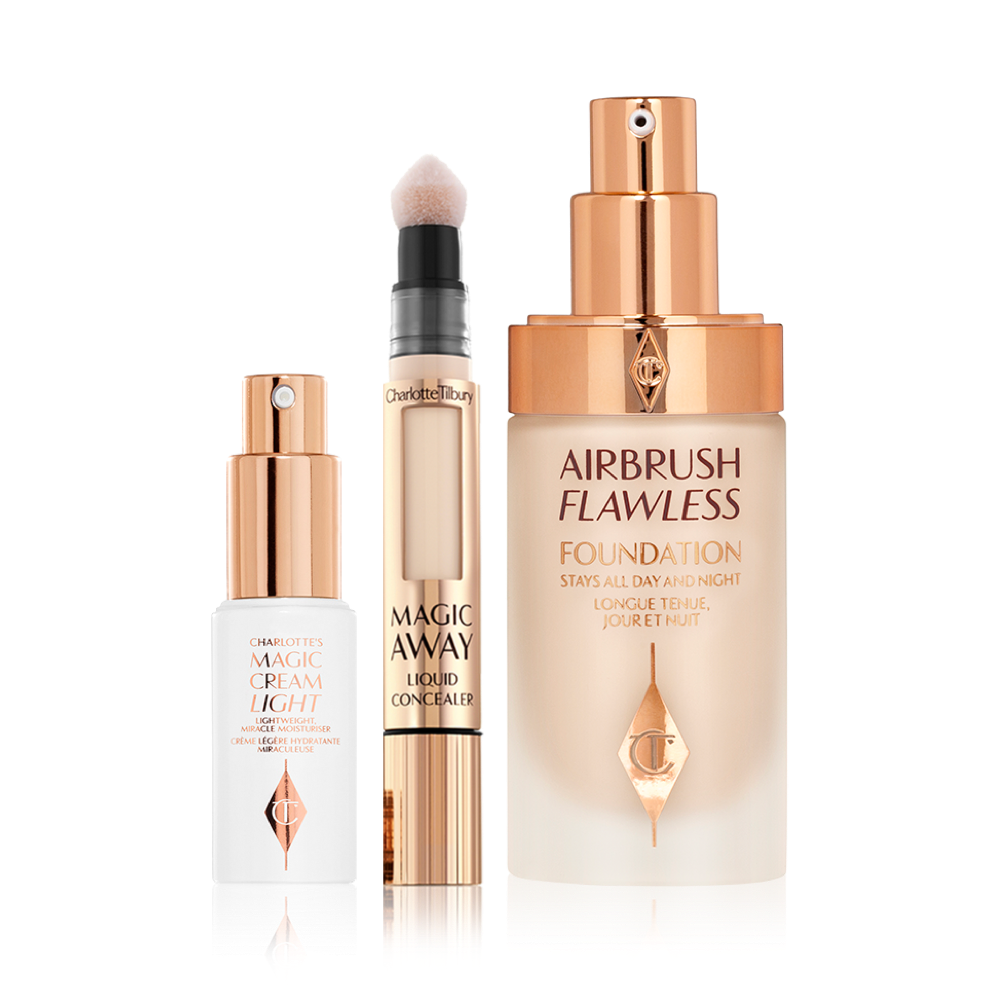Light face cream in a white-coloured bottle with a gold-coloured pump dispenser, concealer with a soft sponge-tip applicator, foundation in a glass bottle with a gold-coloured pump dispenser. 