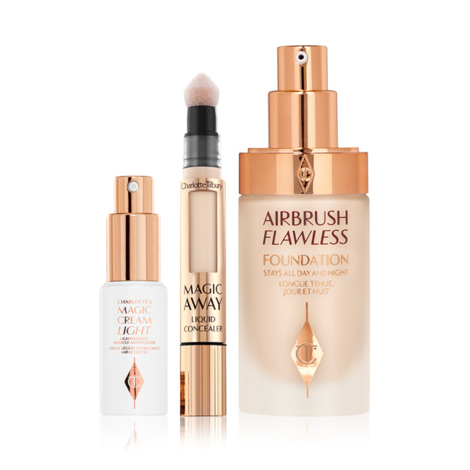 Light face cream in a white-coloured bottle with a gold-coloured pump dispenser, concealer with a soft sponge-tip applicator, foundation in a glass bottle with a gold-coloured pump dispenser. 
