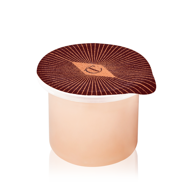 Refill of a peach-coloured, thick and luscious night cream in a petite pot with an easy-to-peel-off cover.