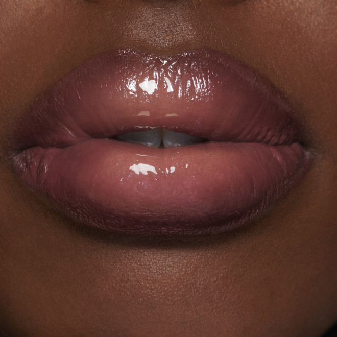 Lip Gloss & Mini Lipstick Kit in Icon Baby on deep skin tone model