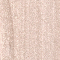 Swatch of a cream highlighter in a soft opal shade. 