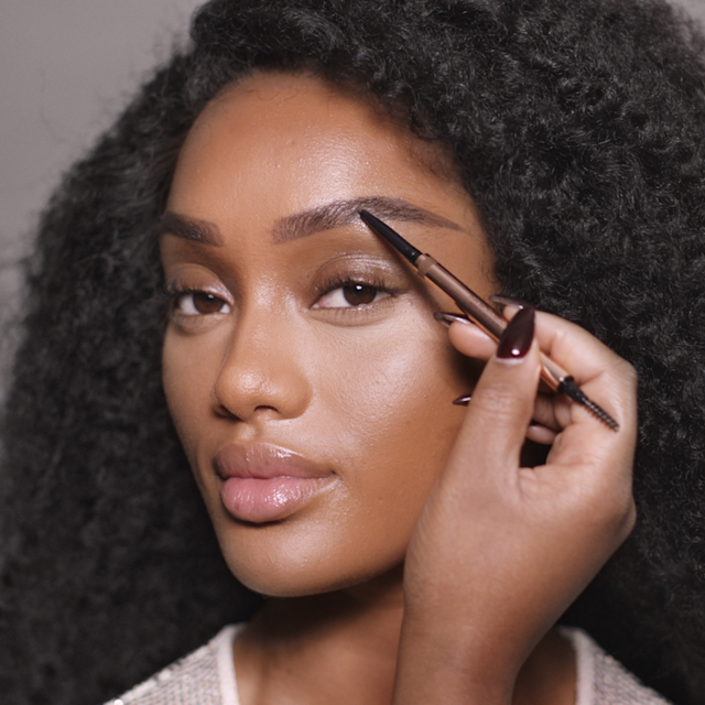 Step 2 in Charlotte's 70s makeup tutorial is creating bushy 70s-inspired brows