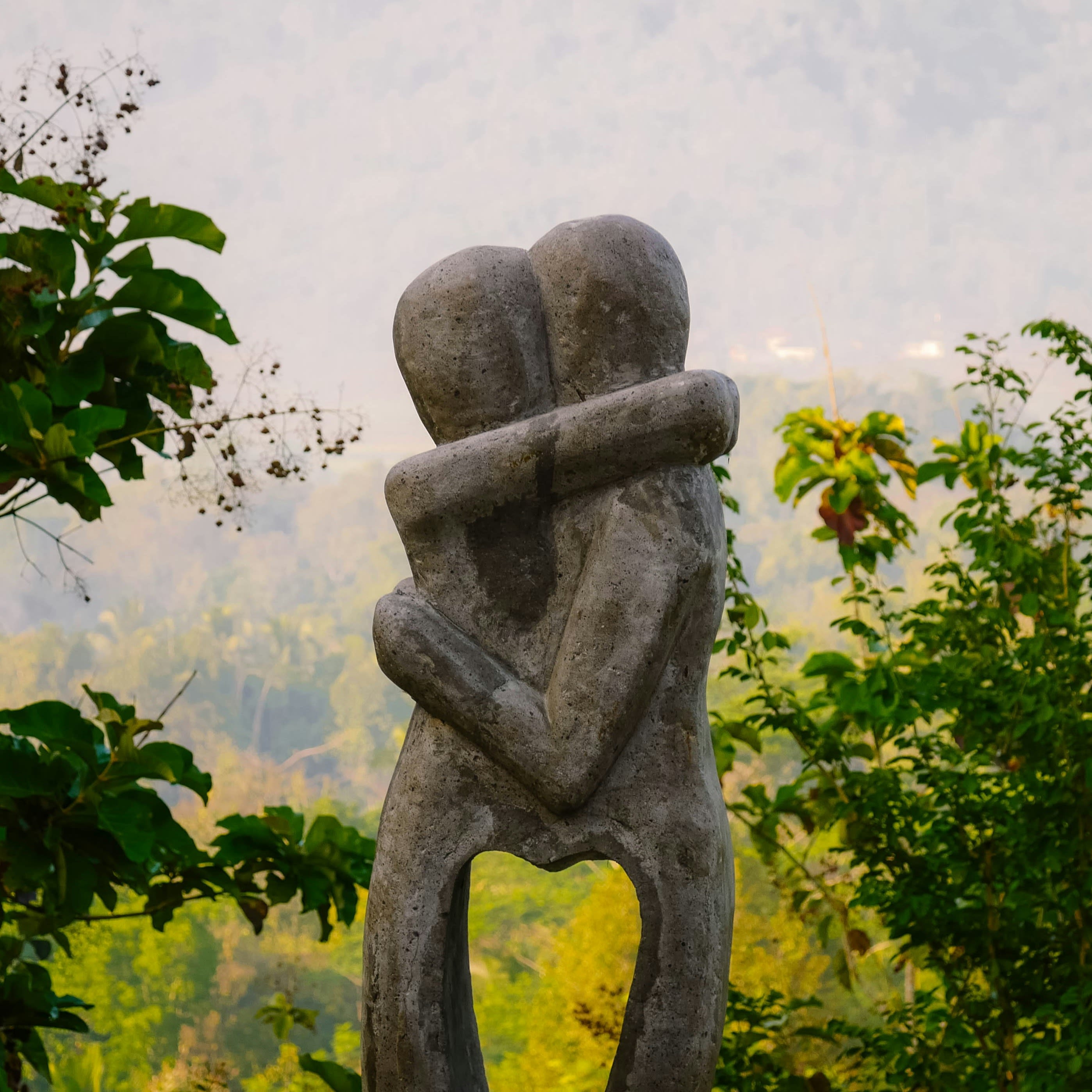 Sculpture of two people sharing a hug