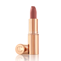 An open, mid-toned muted nude-rose matte lipstick, in sleek, gold-coloured tube. 