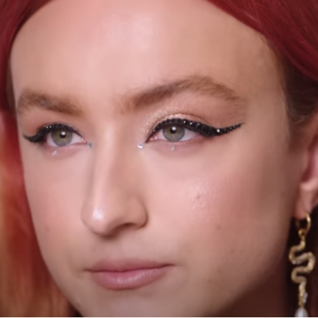 Harris Reed wearing a rhinestone eye makeup look by Sofia Tilbury