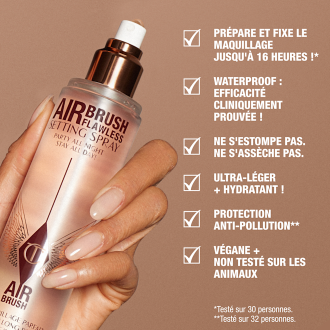 fr-SS-KEY-CLAIMS1-1000x1000 A hand holding a rose-gold bottle of Charlotte Tilbury Airbrush Flawless Setting Spray against a beige background. Text highlights product benefits: primes and sets makeup for up to 16 hours, waterproof, no fading or creasing, weightless and hydrating, anti-pollution shield, vegan and cruelty-free.