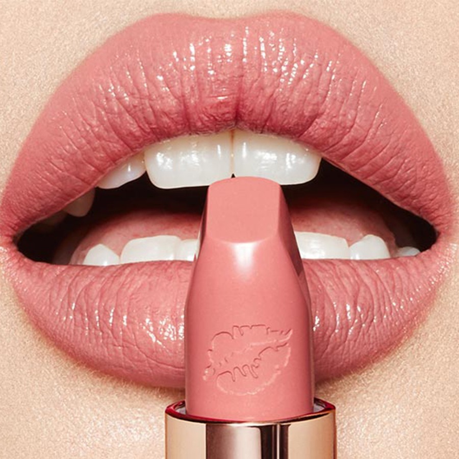 Model with blonde hair wearing Dancefloor Princess Hot Lips 2 lipstick