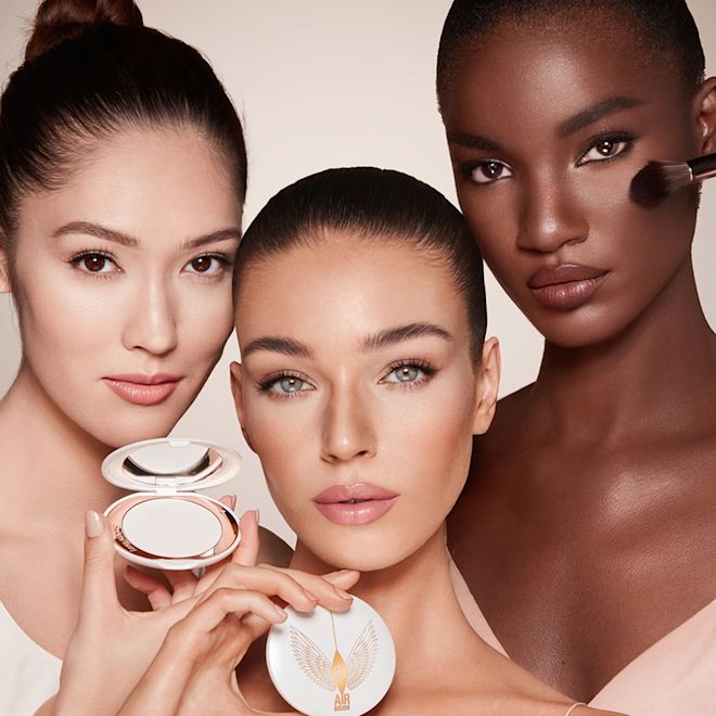 Brightening Airbrush Flawless Finish on Models trio Three models of light, medium and deep skin wearing a radiant, setting powder that brightens, covers blemishes, and makes their skin look fresh,
