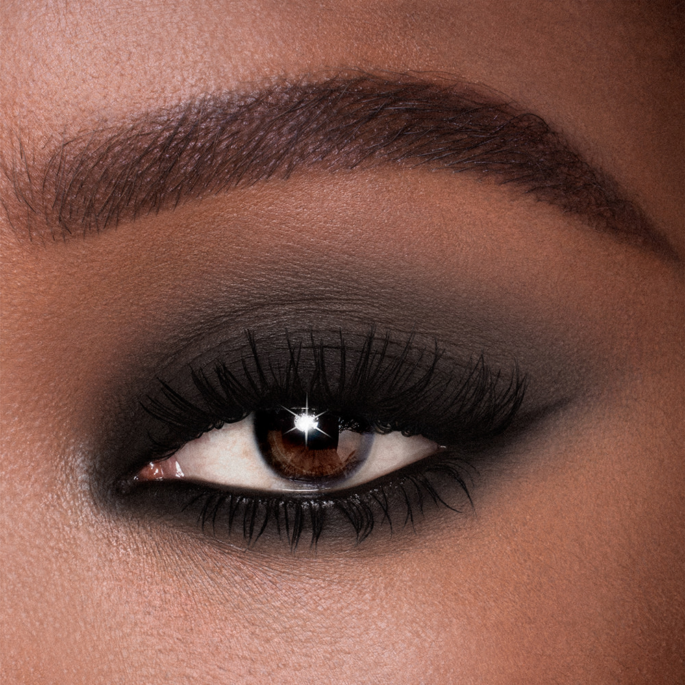 Model wearing a black eyeshadow look using Matte Eyes to Mesmerise cream eyeshadow in Diffused Black