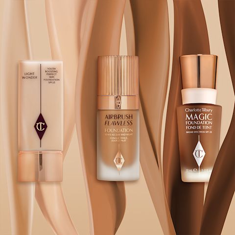 Three foundations, two in frosted glass bottles with gold-coloured-lids and one in a rectangular plastic bottle with a gold-coloured square-shaped lid with their swatches, in fair, tan, and deep tone behind them.