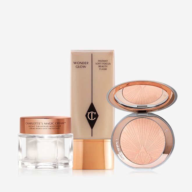 Superstar Glow Secrets displayed Pearly-white face cream in a glass jar with a gold-coloured lid, foundation in a clear bottle with a gold-coloured lid, and powder highlighter in a soft rose-gold shade in a gold-coloured compact with a mirrored-lid.