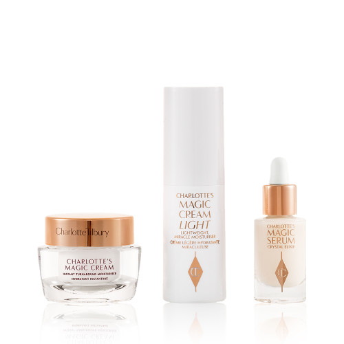 Travel-size pearly-white cream in a glass jar with a gold-coloured lid, luminous serum in a glass bottle with a white and gold dropper lid, and face cream in a white-coloured bottle.