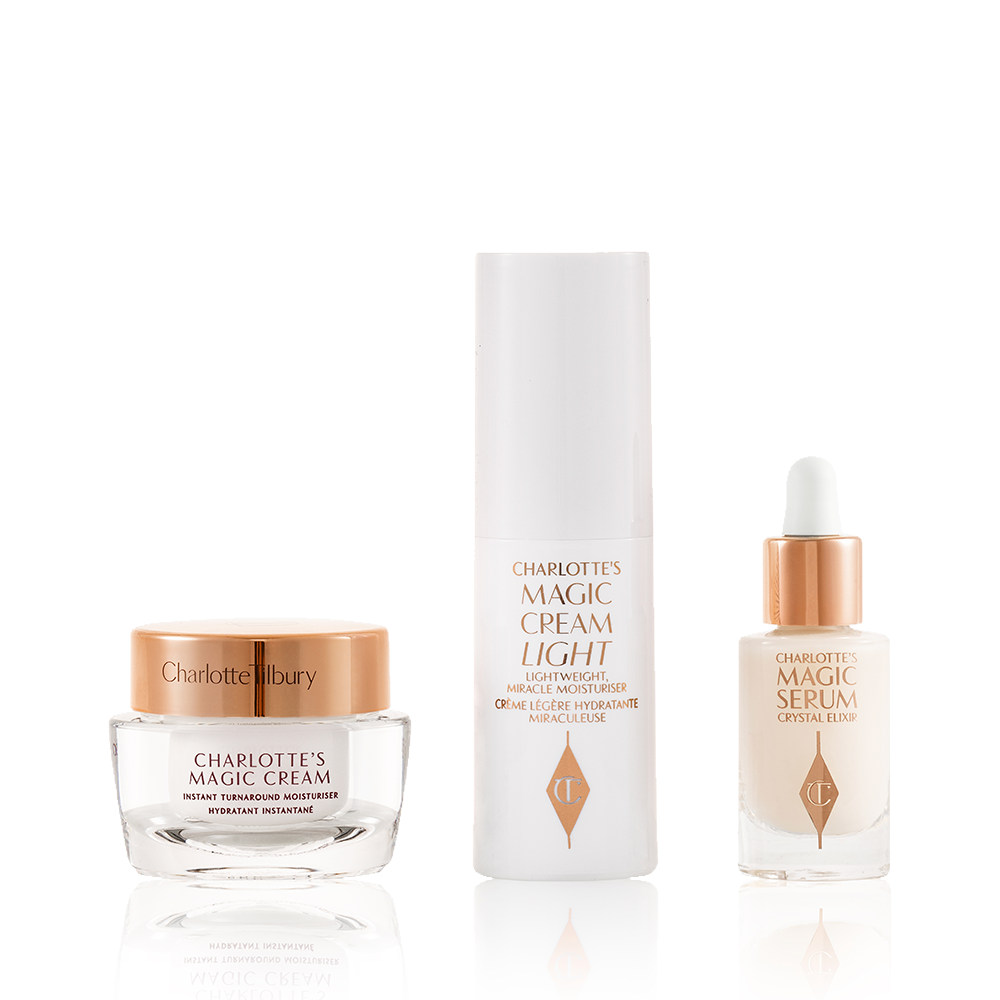 Travel-size pearly-white cream in a glass jar with a gold-coloured lid, luminous serum in a glass bottle with a white and gold dropper lid, and face cream in a white-coloured bottle.