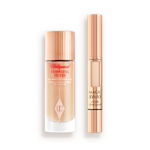 A glow-boosting primer with a fair-tone concealer, both in reflective golden-coloured packaging. 