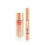 A glow-boosting primer with a fair-tone concealer, both in reflective golden-coloured packaging. 