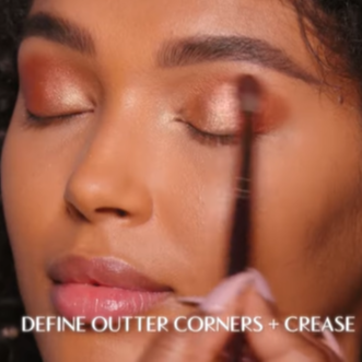 Model wearing the blush and bronzer shades in Glowgasm Face Palette on the eyes