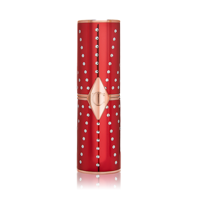 A closed lipstick in a red and gold-coloured tube with rhinestones studded all over. 